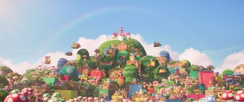Movie still from “The Super Mario Bros. Movie” (2023), directed by Aaron Horvath – A bunch of buildings on top of a hill; Extreme Wide shot, Low angle