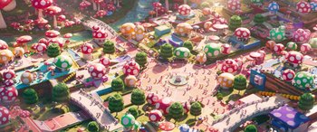 Movie still from “The Super Mario Bros. Movie” (2023), directed by Aaron Horvath – An aerial view of a theme park with a lot of trees and mushrooms; Extreme Wide shot, High angle