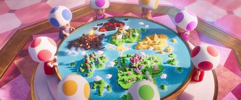 Movie still from “The Super Mario Bros. Movie” (2023), directed by Aaron Horvath – A table that has a lot of toys on it; Extreme Wide shot, High angle