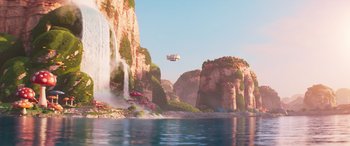 Movie still from “The Super Mario Bros. Movie” (2023), directed by Aaron Horvath – An airplane is flying over the water near a waterfall; Extreme Wide shot, Low angle