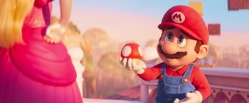 Movie still from “The Super Mario Bros. Movie” (2023), directed by Aaron Horvath – A cartoon character holding a red object in his hand; Close Up shot, Over the shoulder angle