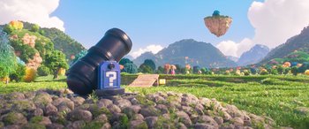 Movie still from “The Super Mario Bros. Movie” (2023), directed by Aaron Horvath – A telescope sitting in the middle of a grassy field; Extreme Wide shot, Low angle