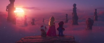 Movie still from “The Super Mario Bros. Movie” (2023), directed by Aaron Horvath – A group of people standing on top of a hill; Wide shot, Low angle