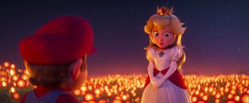 Movie still from “The Super Mario Bros. Movie” (2023), directed by Aaron Horvath – A princess peach doll standing in front of mario; Medium shot, Over the shoulder angle