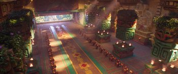 Movie still from “The Super Mario Bros. Movie” (2023), directed by Aaron Horvath – An image of an ancient building with a lot of candles in it; Extreme Wide shot, High angle