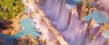 Movie still from “The Super Mario Bros. Movie” (2023), directed by Aaron Horvath – An aerial view of a bridge over a body of water; Extreme Wide shot, Overhead angle