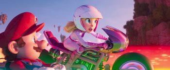 Movie still from “The Super Mario Bros. Movie” (2023), directed by Aaron Horvath – A girl in a helmet is riding on a motorcycle; Wide shot, Low angle