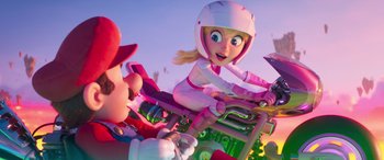 Movie still from “The Super Mario Bros. Movie” (2023), directed by Aaron Horvath – A woman riding on the back of a pink motorcycle; Medium shot, Low angle