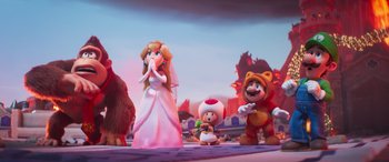 Movie still from “The Super Mario Bros. Movie” (2023), directed by Aaron Horvath – A group of figurines of princess peach , toad , mario , and other characters; Wide shot, Over the shoulder angle