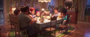 Movie still from “The Super Mario Bros. Movie” (2023), directed by Aaron Horvath – A group of people sitting around a table eating; Wide shot, Over the shoulder angle