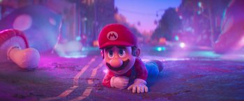 Movie still from “The Super Mario Bros. Movie” (2023), directed by Aaron Horvath – A character laying on the ground in the street; Wide shot, High angle
