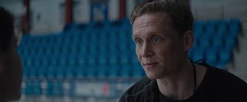 Movie still from “The Swimmers” (2022), directed by Sally El Hosaini – A person wearing a black t - shirt; Close Up shot, Low angle