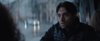 Movie still from “The Swimmers” (2022), directed by Sally El Hosaini – A person looking out a window; Close Up shot, Over the shoulder angle