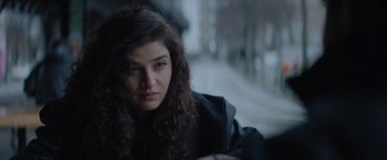 Movie still from “The Swimmers” (2022), directed by Sally El Hosaini – A person with curly hair; Close Up shot, Over the shoulder angle