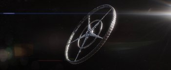 Movie still from “Elysium” (2013), directed by Neill Blomkamp – An image of an object in the shape of a wheel; Extreme Wide shot, Overhead angle