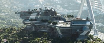 Movie still from “Elysium” (2013), directed by Neill Blomkamp – An aerial view of a city with a mountain in the background; Extreme Wide shot, High angle
