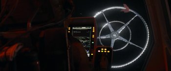 Movie still from “Elysium” (2013), directed by Neill Blomkamp – A view of a steering wheel from inside a vehicle; Extreme Wide shot, Overhead angle