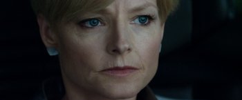 Movie still from “Elysium” (2013), directed by Neill Blomkamp – A woman's face with blue eyes; Close Up shot, Over the shoulder angle