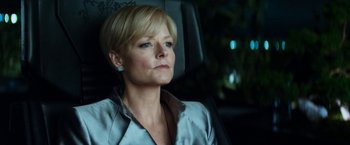 Movie still from “Elysium” (2013), directed by Neill Blomkamp – A woman sitting in the back seat of a car; Close Up shot, Low angle