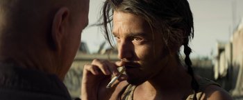 Movie still from “Elysium” (2013), directed by Neill Blomkamp – A person brushing his teeth; Close Up shot, Over the shoulder angle