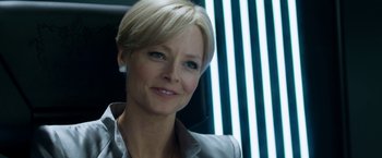 Movie still from “Elysium” (2013), directed by Neill Blomkamp – A person with short hair; Close Up shot, Over the shoulder angle