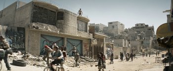 Movie still from “Elysium” (2013), directed by Neill Blomkamp – A man standing on the roof of a building; Extreme Wide shot, High angle