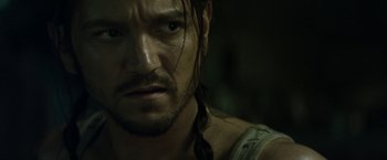 Movie still from “Elysium” (2013), directed by Neill Blomkamp – Close up of a man's face with long hair; Close Up shot, Over the shoulder angle