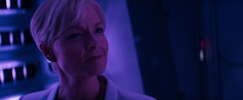 Movie still from “Elysium” (2013), directed by Neill Blomkamp – An older woman with blue eyes looking into the distance; Close Up shot, Low angle