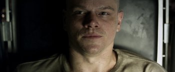 Movie still from “Elysium” (2013), directed by Neill Blomkamp – A man with a bald head and a shaved head; Close Up shot, Low angle