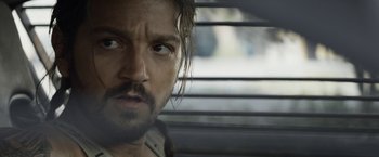 Movie still from “Elysium” (2013), directed by Neill Blomkamp – A person looking out of a car window; Close Up shot, Over the shoulder angle