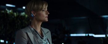 Movie still from “Elysium” (2013), directed by Neill Blomkamp – A person wearing a headset; Close Up shot, Low angle