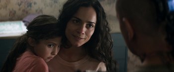 Movie still from “Elysium” (2013), directed by Neill Blomkamp – A woman and a child looking into a mirror; Close Up shot, Over the shoulder angle