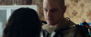 Movie still from “Elysium” (2013), directed by Neill Blomkamp – A man and a woman looking at one another; Close Up shot, Over the shoulder angle