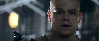 Movie still from “Elysium” (2013), directed by Neill Blomkamp – A bald man with a shaved head and a shaved head; Close Up shot, Low angle