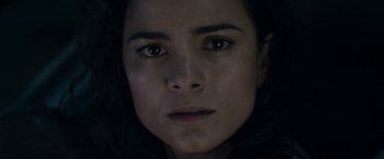 Movie still from “Elysium” (2013), directed by Neill Blomkamp – A woman's face in the dark; Close Up shot, High angle