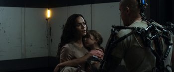 Movie still from “Elysium” (2013), directed by Neill Blomkamp – A woman holding a little girl in her arms; Close Up shot, Over the shoulder angle