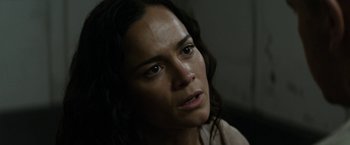 Movie still from “Elysium” (2013), directed by Neill Blomkamp – A person with long dark hair; Close Up shot, High angle