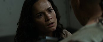 Movie still from “Elysium” (2013), directed by Neill Blomkamp – A person looking at the camera; Close Up shot, Over the shoulder angle