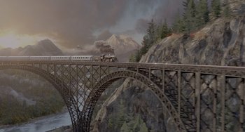 Movie still from “The Tax Collector” (2020), directed by David Ayer – A train is crossing a bridge over a river; Extreme Wide shot, High angle