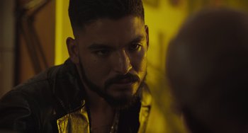 Movie still from “The Tax Collector” (2020), directed by David Ayer – A person with a beard; Close Up shot, Over the shoulder angle