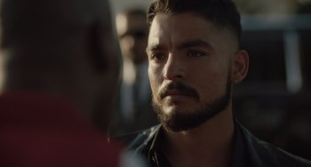 Movie still from “The Tax Collector” (2020), directed by David Ayer – A person with a beard; Close Up shot, Over the shoulder angle