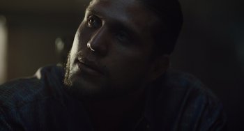 Movie still from “The Tax Collector” (2020), directed by David Ayer – A person with a beard; Close Up shot, Low angle