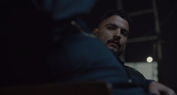 Movie still from “The Tax Collector” (2020), directed by David Ayer – A person looking at the camera; Close Up shot, Over the shoulder angle