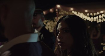 Movie still from “The Tax Collector” (2020), directed by David Ayer – A person looking at the camera; Close Up shot, Over the shoulder angle