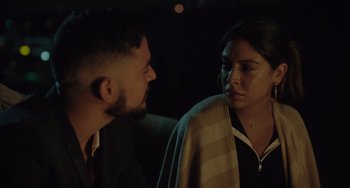 Movie still from “The Tax Collector” (2020), directed by David Ayer – A man and a woman talking to each other; Close Up shot, Over the shoulder angle