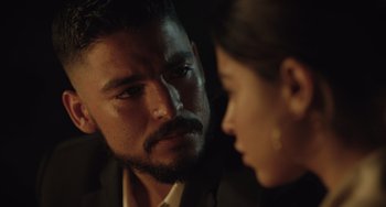 Movie still from “The Tax Collector” (2020), directed by David Ayer – A person looking at another person; Close Up shot, Over the shoulder angle