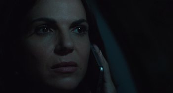 Movie still from “The Tax Collector” (2020), directed by David Ayer – A person talking on a cell phone; Close Up shot, Over the shoulder angle