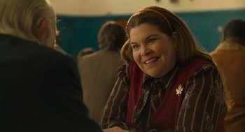 Movie still from “The Tender Bar” (2021), directed by George Clooney – A person sitting at a table; Close Up shot, Over the shoulder angle
