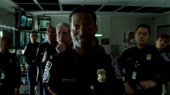 Movie still from “The Terminal” (2004), directed by Steven Spielberg – A group of police officers standing next to each other; Close Up shot, Low angle