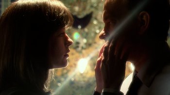 Movie still from “The Terminal” (2004), directed by Steven Spielberg – A man and a woman looking at each other; Extreme Close Up shot, Low angle